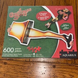 A Christmas Story NEW 600 Piece 2 Sided Leg Lamp Puzzle  by Aquarius 13” x 30”